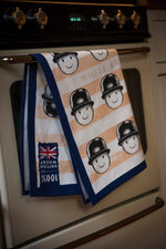 Fred orange tea towel by Tom Hovey